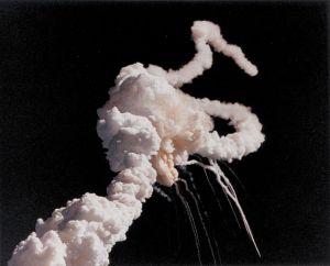 Smoke-plume of Space Shuttle Challenger, January 28, 1986. The disaster resulted in the deaths of all seven crew members.