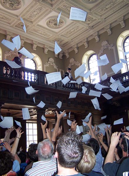 Results are read out at the Senate House and then tossed from the balcony. [Photograph from http://en.wikipedia.org/wiki/File:Mathmo_results.jpg] 