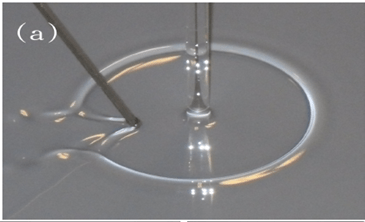 Experimental production of sink bore with viscous oil. Note the "Mach cone". 