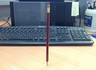 A pencil balanced on its point. Is there a trick? Yes: see below.